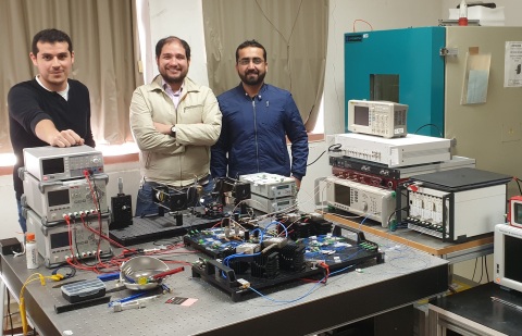 The research team is shown with the optical setup for their new direct hyperspectral dual-comb imaging approach. The method expands the point-detection capabilities of current dual-comb systems to create a spectral image of an entire scene. Credit: Pedro Martín-Mateos, Universidad Carlos III de Madrid