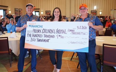 Ron Amstutz, Executive Vice President at Desert Financial Credit Union, Susan O’Donnell, Children’s Miracle Network Program Director at PCH, and Jeff Meshey, President & CEO of Desert Financial pose with the donation check. (Photo: Business Wire)