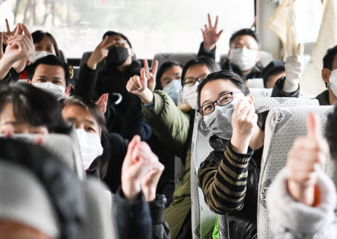 Recovered patients on a bus going back home after a 14-day quarantine for medical observation at a rehabilitation center, Wuhan, March 10, 2020. /Xinhua