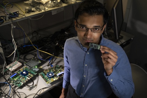 Intel Labs’ Nabil Imam holds a Loihi neuromorphic test chip in his Santa Clara, California, neuromorphic computing lab. He and a research team from Cornell University are building mathematical algorithms on computer chips that mimic what happens in your brain’s neural network when you smell something. (Credit: Walden Kirsch/Intel Corporation)