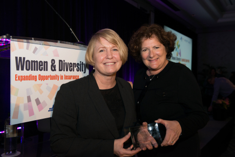 Church Mutual WLI President Kathy Iriarte, left, accepts the Women and Diversity award on behalf of Church Mutual from APCIA Chief Operating Officer June Holmes during the Feb. 28 conference in New York City. (Photo: Church Mutual)