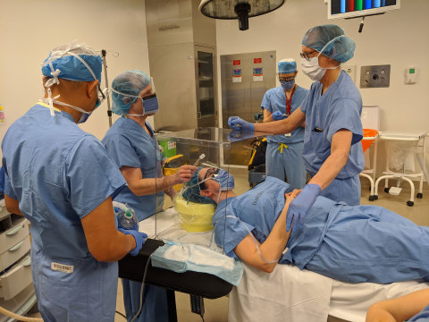 Physicians at Humber River Hospital in Toronto demonstrate use of new intubation boxes that provide extra line of defense during COVID-19. Klick Health helped with prototyping and is donating 300 boxes to city hospitals. (Photo: Business Wire)