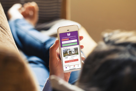 House hunters can use the free HomeRover app to identify a home, request a live video home tour and watch from the comfort of their couch. (Photo: Business Wire)