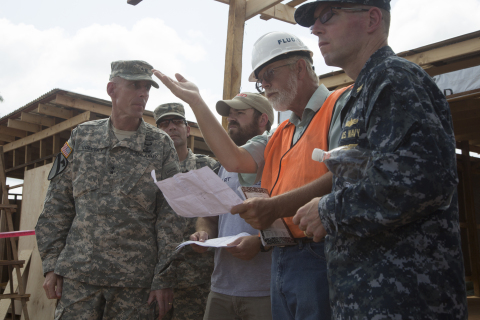 Fluor employees on LOGCAP IV Africa review and discuss a project with the U.S. Army. (Photo: Business Wire)