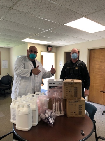 Pharmacy Solutions in Ann Arbor, Mich., has donated gallons of hand sanitizer and other personal protective equipment to local first responders to help curb coronavirus spread. (Photo: Business Wire)