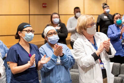 NYC Health + Hospitals/Elmhurst nurses celebrate with a standing ovation and cheer, 