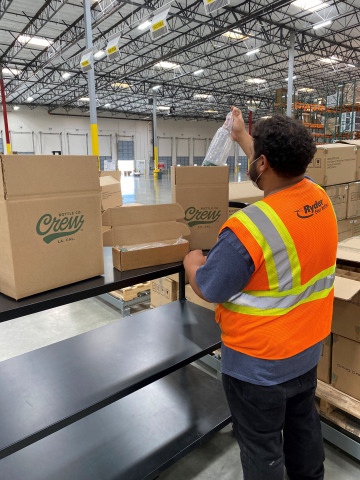 With food safety paramount to Crew Bottle Co., the company chose Ryder’s FDA-certified e-commerce fulfillment facility near Los Angeles, where a Ryder employee inspects inventory inside protective wrapping.  (Photo: Business Wire)
