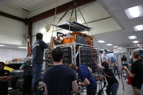 Astranis engineers load their small communications satellite into a thermal-vacuum shroud. (Photo: Business Wire)