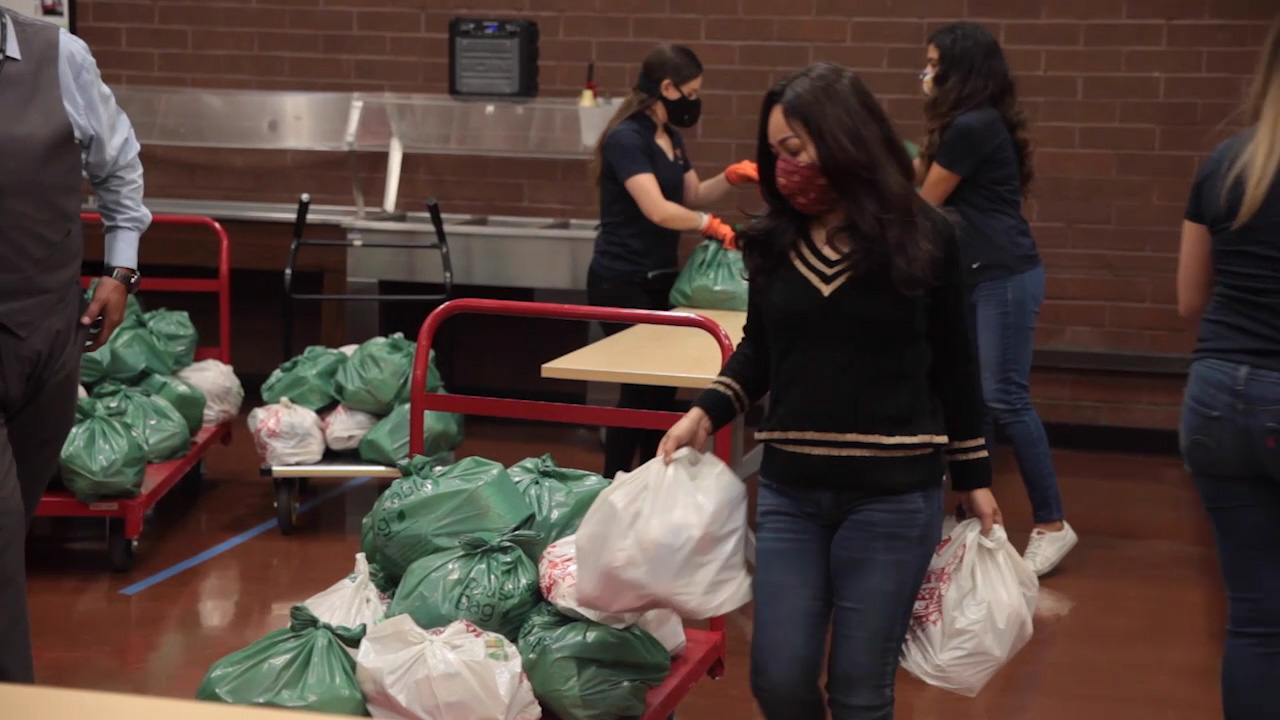 B ROLL -- Volunteers Packing and Preparing Food Boxes