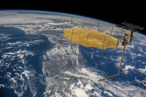 Artist concept of a Capella synthetic aperture radar satellite. Capella uses AWS services and infrastructure, including AWS Ground Station, to communicate with its satellites, and then downlink, process, and distribute satellite data within minutes of its capture. (Courtesy Capella Space; background image courtesy NASA)