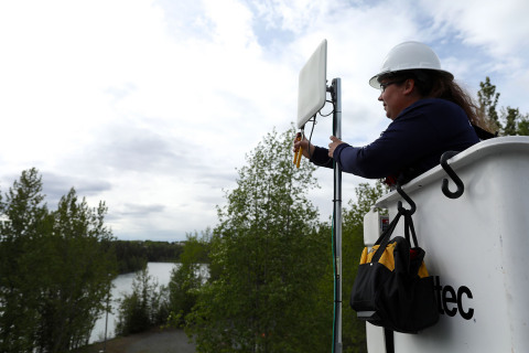 Alaska Communications Field Technician Kristine Barber installs fixed wireless at a home in Sterling, Alaska. (Photo: Business Wire)
