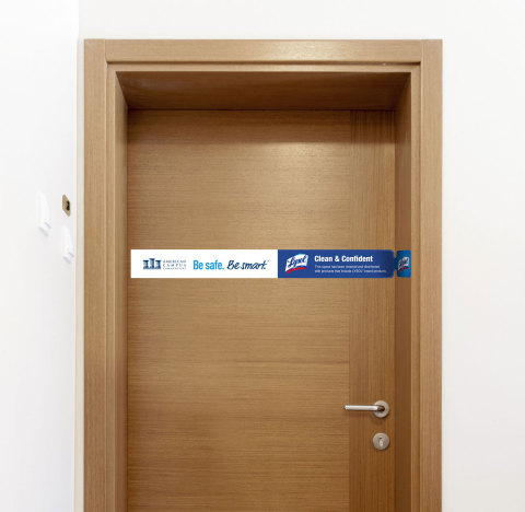 Lysol door wrap for ACC student apartments (Photo: Business Wire)