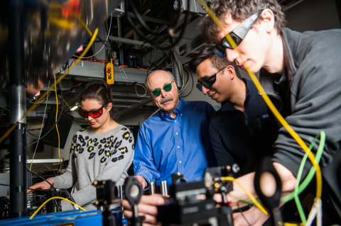 David Awschalom, physicist at UChicago and Argonne National Laboratory, reviews data from a quantum information experiment with graduate students in his lab.  (Image by UChicago)