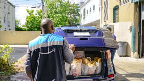 An Amazon Flex driver loads his vehicle with groceries from Bread for the City, a Washington, D.C. food pantry. Amazon is donating delivery services so that food can be brought directly to the homes of people in need. (Photo: Business Wire)
