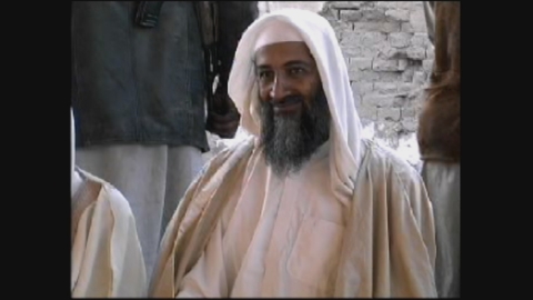 Osama bin Laden sitting at a gathering. (Karga Seven Pictures)