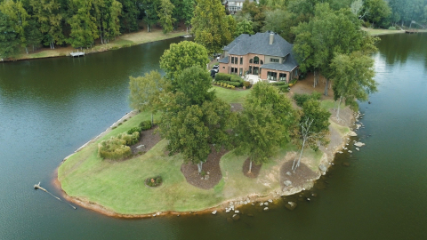 Located on the point of a local lake, the McSweeney property offers stunning views and the tranquility that comes with being surrounded by water. (Photo: Business Wire)