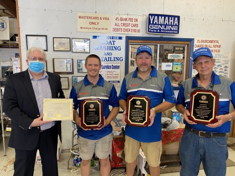 Dustin Bearden is the first to complete the Yamaha Marine Apprentice Program. (Left to Right) Florida Department of Education Apprenticeship Director, Ted Norman, Sunshine Marine Apprentice, Dustin Bearden, Sunshine Marine Co-Owner, Marvin Lawler, Sunshine Marine Co-Owner and Mentor, Pete Magnuson.