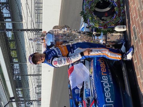 Takuma Sato, celebrating his second Indy 500 win next to his PeopleReady branded car. PeopleReady is the primary sponsorship partner with Sato and the Rahal Letterman Lanigan Racing team. (Photo: Business Wire)