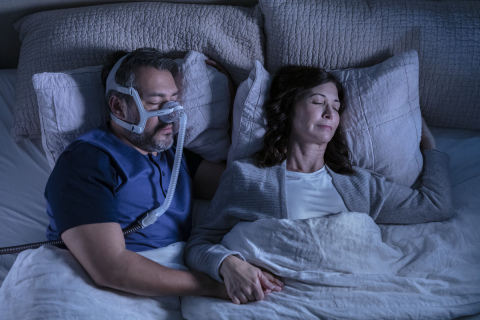 ResMed AirTouch N20 nasal CPAP mask, couple sleeping, overhead view (Photo: Business Wire)