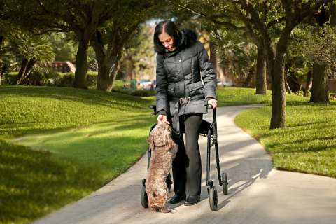 Josie Ingber, who has multiple sclerosis, maintains her independence and mobility with the LifeGlider, a walking aid that secures the center of gravity to eliminate users' fear of falling. (Photo: Business Wire)