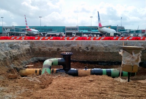 Teams install hydrant system piping and pits at the international terminal expansions at the El Dorado Airport in Bogota, Colombia. (Photo: Business Wire)