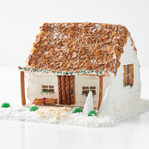 Dolly Parton Launches New Collaboration with Williams Sonoma Featuring a Gingerbread Log Cabin Replica of Her Childhood Home (Photo: Williams Sonoma)