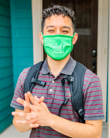 Texas State University student wearing Hi, How Are You Project mask. (Photo: Business Wire)