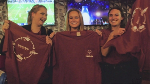 North Carolina State University students Sydney Parker, Katy Powers and Mamie Trigg present their self-designed T-shirts to campus students during a wrap party for “Crop to Campus,” a seven-part, minidocumentary that follows the students on a step-by-step exploration of making a sustainable T-shirt. (Photo: Business Wire)