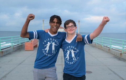Friendship Foundation buddies Marcus and Owen celebrate at last year's Skechers Pier to Pier Friendship Walk. The annual event will be held virtually on Sunday, October 25th, featuring celebrities, sponsors and the community to support children with special needs and education. (Photo: Business Wire)