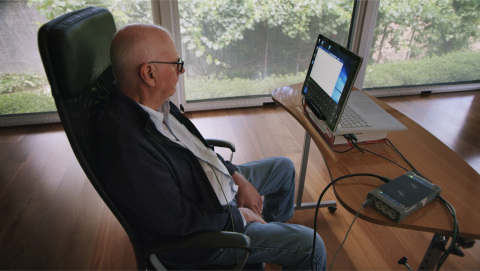 Graham Felstead, the first patient enrolled in the first Stentrode clinical study and the first person to have any BCI implanted via the blood vessels. He utilized the Stentrode to control the Microsoft Windows 10 operating system, in combination with an eye-tracker for cursor navigation, without the need for a mouse or keyboard. (Photo: Synchron, Inc.)
