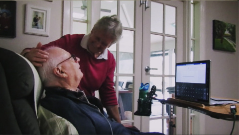 Graham Felstead, a 75-year-old man who has ALS and lives at home with his wife, was the first patient enrolled in the first Stentrode clinical study.  He was able to achieve his goals of remotely contacting his spouse, increasing his autonomy and reducing her burden of care. (Photo: Synchron, Inc.)