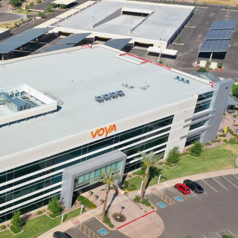 Voya’s new Chandler, Arizona, facility was built with environmental sustainability in mind, including nine solar carports expected to offset more than 663,600 kilowatt-hours of electricity in its first year of operation alone. (Photo: Business Wire)