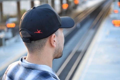 OURA's signature crane can be found on the back of every Unity hat, the latest line dedicated to pediatric cancer patients. (Photo: Business Wire)