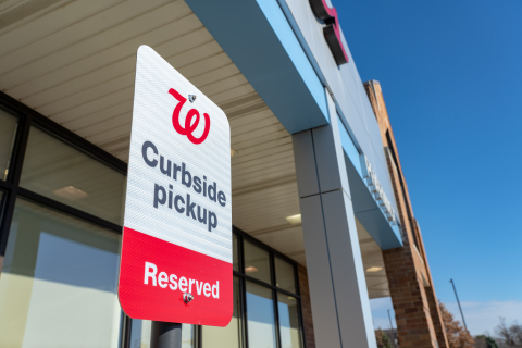 Walgreens pickup at curbside sign (Photo: Business Wire)