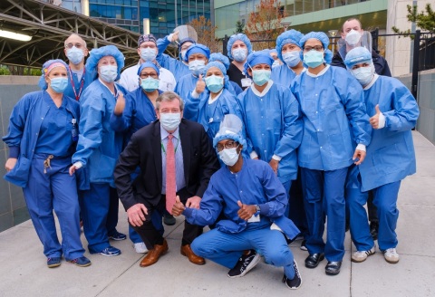 Michael Dowling, president and CEO of Northwell Health poses with some of Northwell’s frontline heroes. (Credit: Northwell Health)