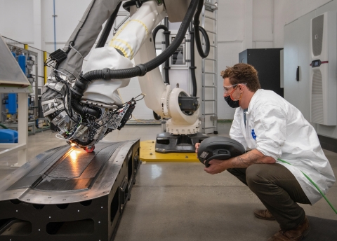 Shown here: In a Joby Aviation composites lab an automated fiber placement (AFP) machine applies composite material used to fabricate aircraft parts. High performance composite materials are essential in making the Joby aircraft lightweight. Location: Joby's Marina, CA facility is the future of manufacturing for Joby. Photographer: John Kaemmerling