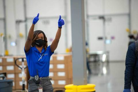 At McKesson’s Olive Branch, Miss. distribution center, a worker celebrates as the Moderna COVID-19 vaccine begins to be shipped. (Photo: Business Wire)