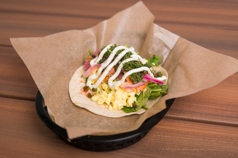 Torchy's Tacos' all-new January Taco of the Month, the Fancy Schmancy, features hot smoked salmon, scrambled eggs, fresh spinach, capers, pickled onions & jalapenos, fresh dill and herb cream cheese served on a flour tortilla. (Photo: Business Wire)