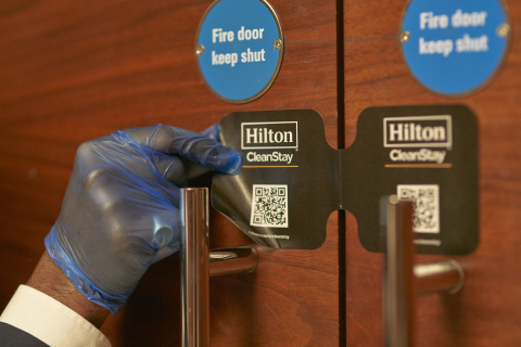 Team member places Hilton CleanStay Room Seal after full cleaning of ballroom at Conrad London St. James. (Photo: Business Wire)