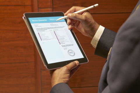 As part of Hilton EventReady with CleanStay, a team member ensures the top 10 touchpoints have been properly cleaned at Hilton Worldwide Sales’ global hybrid event at Conrad London St. James’ in London. (Photo: Business Wire)