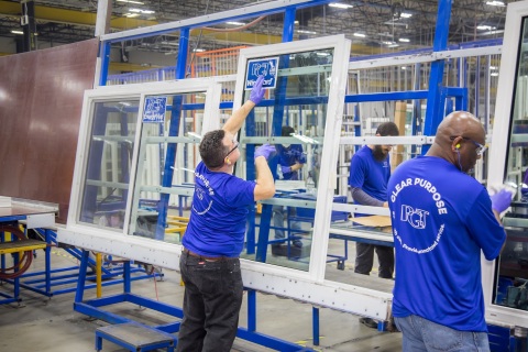 Employees inside one of PGT Innovations’ manufacturing facilities (Photo: Business Wire)