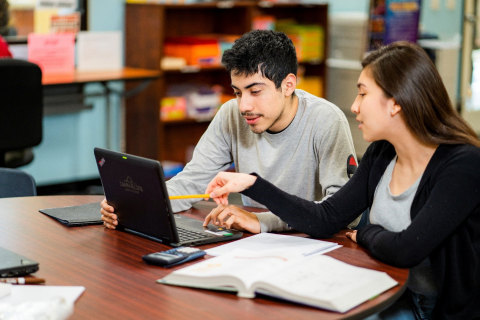 A Learn4Life student and teacher work one-on-one in a personalized learning setting pre-pandemic (Photo: Business Wire)