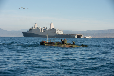 Amphibious Combat Vehicle swimming in front of ship during testing in Pacific Ocean. Photo credit: BAE Systems