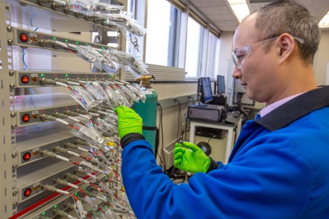 Phillips 66 Senior Engineer Liang Zhang is shown testing small batteries to evaluate Phillips 66 carbon products as sodium-ion battery anode materials. (Photo: Phillips 66)