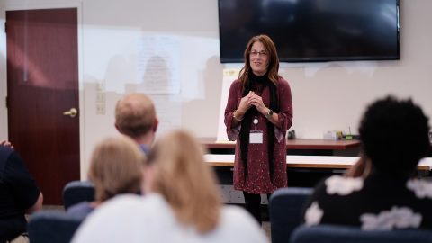 An A2W Team Lead speaks to a group of candidates during the Job Readiness Training, an extended workforce development training and competency assessment. (Photo: Business Wire)
