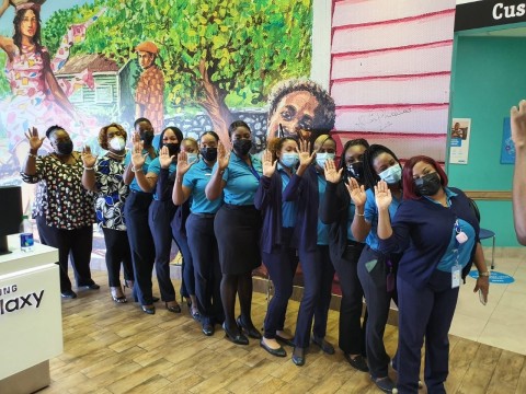 Employees at the Southwest Plaza store in Nassau, Bahamas, striking the #ChooseToChallenge pose in support of the International Women's Day global campaign. (Photo: Business Wire)