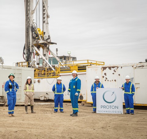 thumbnail Proton Technologies Canada team members pose in front of the world's first hydrogen well. (Photo: Business Wire)