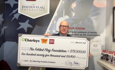 O'Charley's CEO Craig Barber presenting The Folded Flag Foundation with a check for $575,000 - all the money O'Charley's helped raise for the foundation in 2020! (Photo: Business Wire)