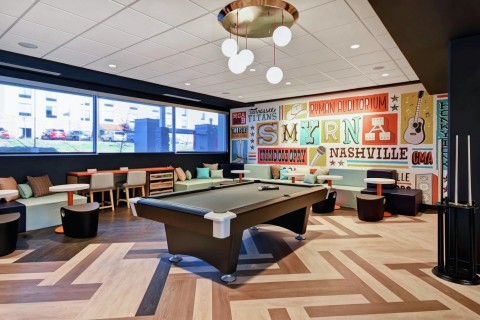 The inside track: Tru’s lobby offers billiards and plenty of space for spectators.