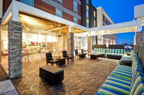 Slow down for the night on the outdoor patio at the Home2 Suites (pets welcome!).